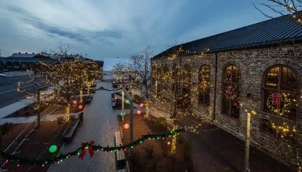 Christkindlmarkt ready to open at dusk in beautiful lights surrounded by the industrial and historic center of Bethlehem