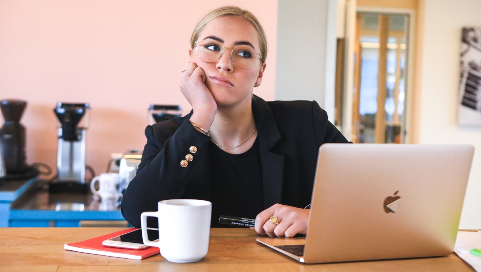 Young professional woman pondering her career