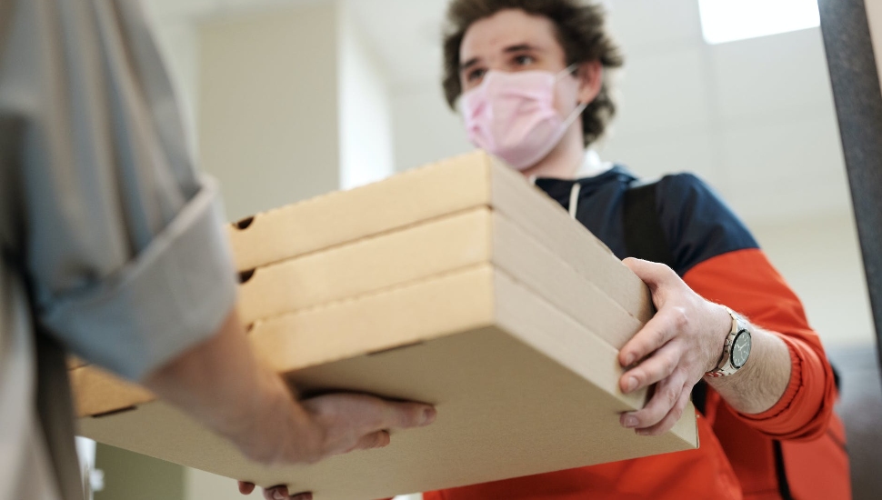 maske dman with pizza boxes