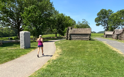 A runner jogging the trail in Valley Forge National Park