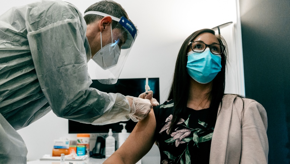 girl getting covid-19 vaccine