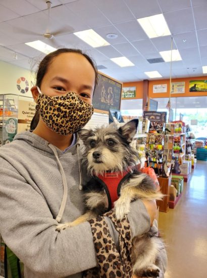 Dog and owner ready to shop for treats at perk valley pet eatery.