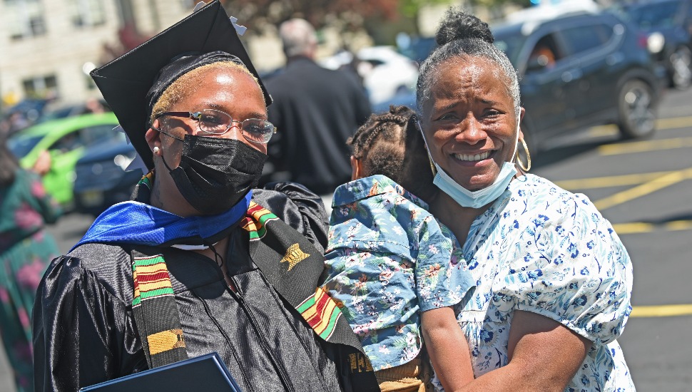 Manor College graduate with family