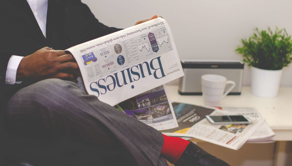 Man reading a business newspaper