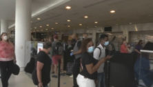 A crowd waits inStaffing Shortages at Philadelphia International Airport