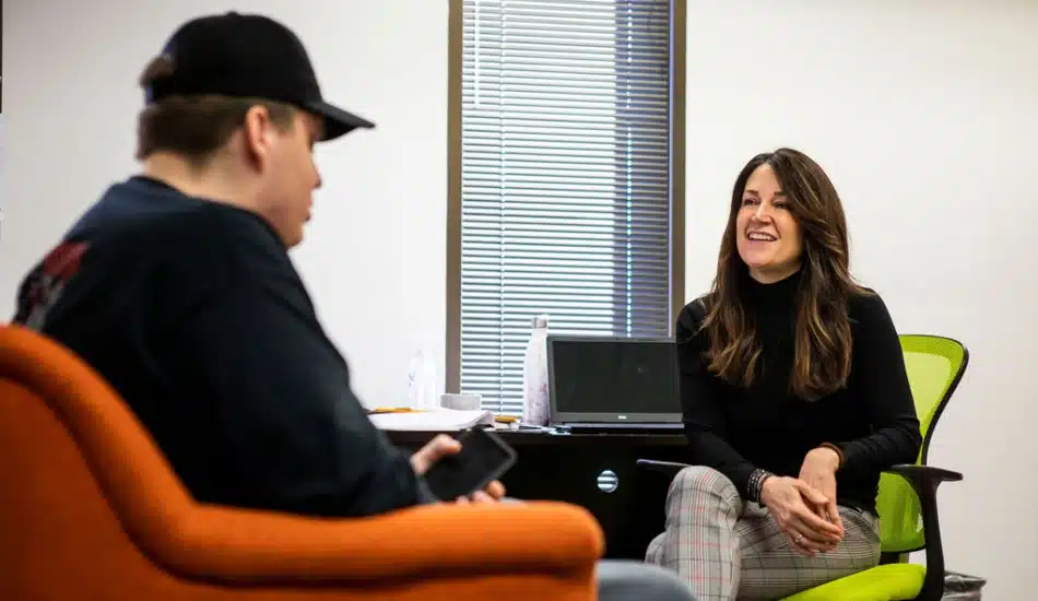 A student speaks with a School-Based Counselor