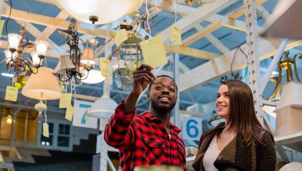 man and woman shopping lamps