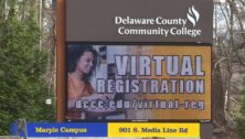 The Delaware County Community College billboard outside its Marple campus. College vaccinations are being implemented at local universities.