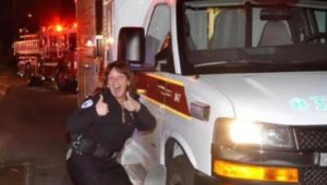 Mary Ellis strikes a humorous pose while working as an EMT.