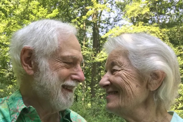 Al and Gwen Gilens in their wooded backyard.
