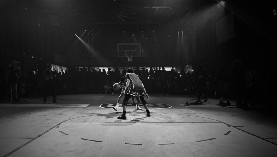 man playing basketball overtime elite