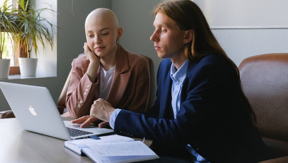two people on laptop