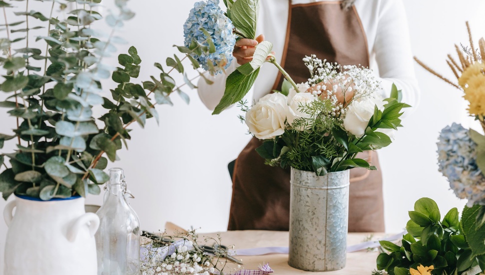 woman arranging flowers