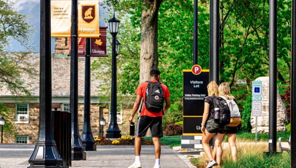 Students hang out on a college campus.