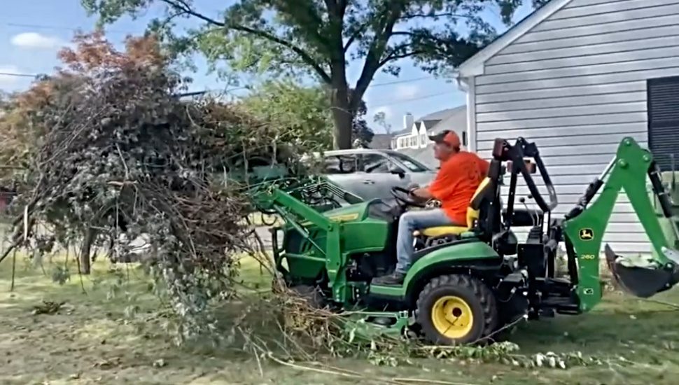 Barbara Mass cleanup on tractor.