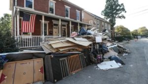 Debris piled in street after Hurricane Ida