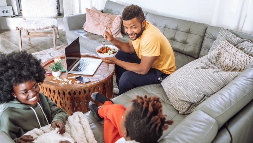 family on sofa in family room