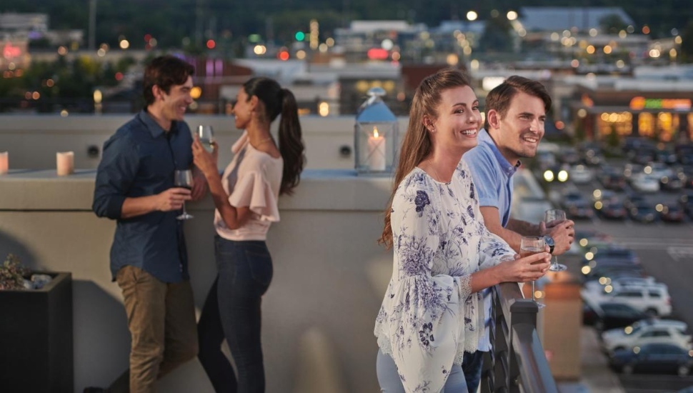 man and woman on rooftop.