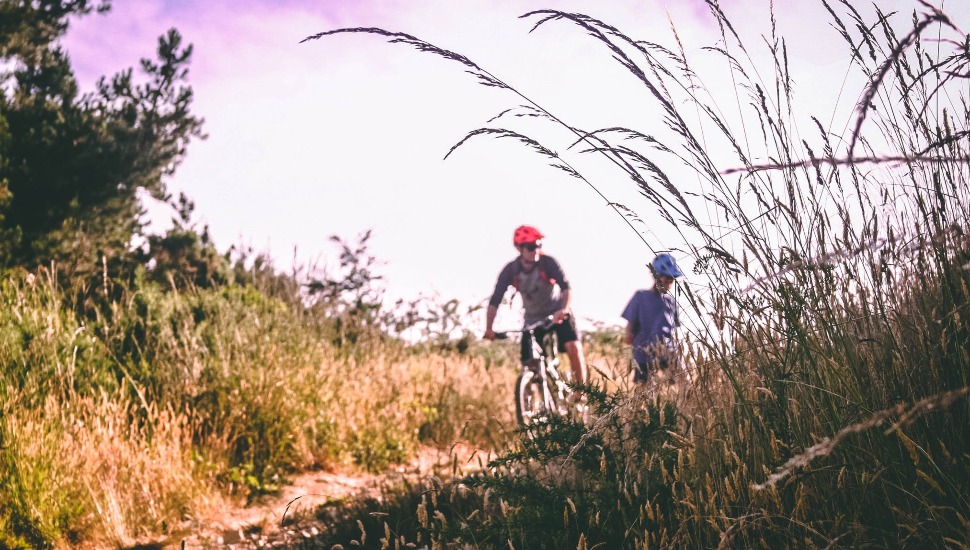 people mountain biking.