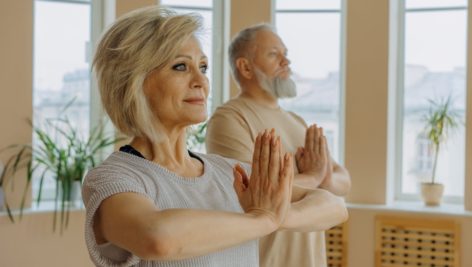 Retired adults doing yoga