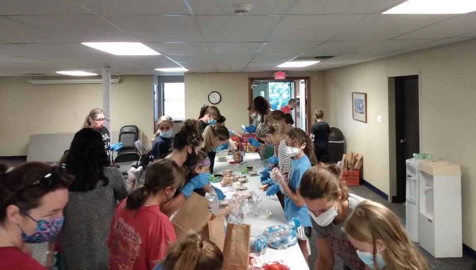 people making sandwiches