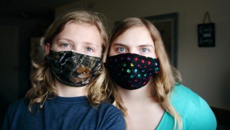 child and mom with masks