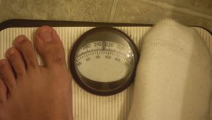 obesity feet on scale