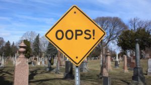 Oops! Sign in a graveyard