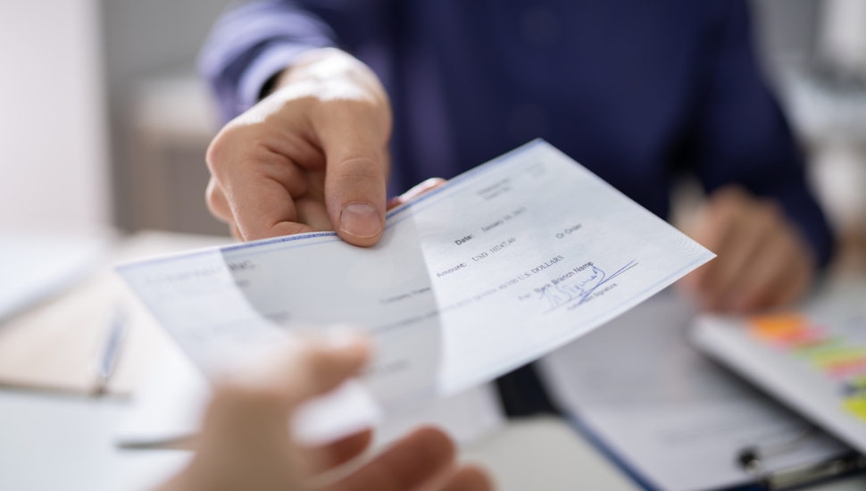 A man receiving his paycheck