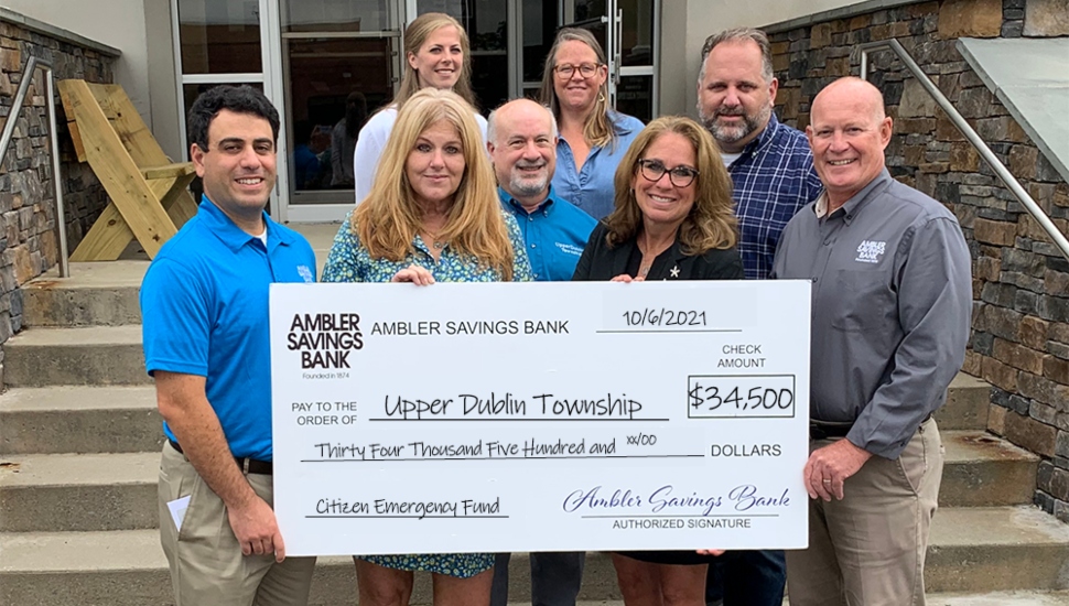 bank employees with check