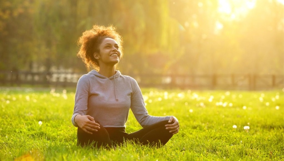 wellness week girl in grass