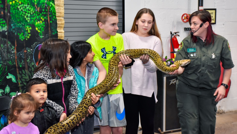 kid holding snake COVER 2021 - MONTCO.Today