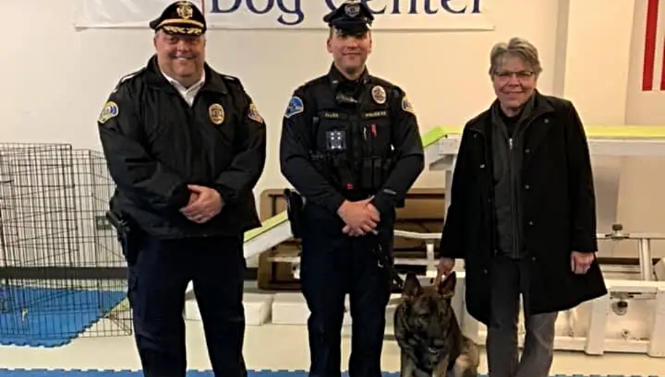 Officer Ryan Allen, Chief Gardner, and Mayor Guenst posed with K-9 Louie at Patrol School Graduation.