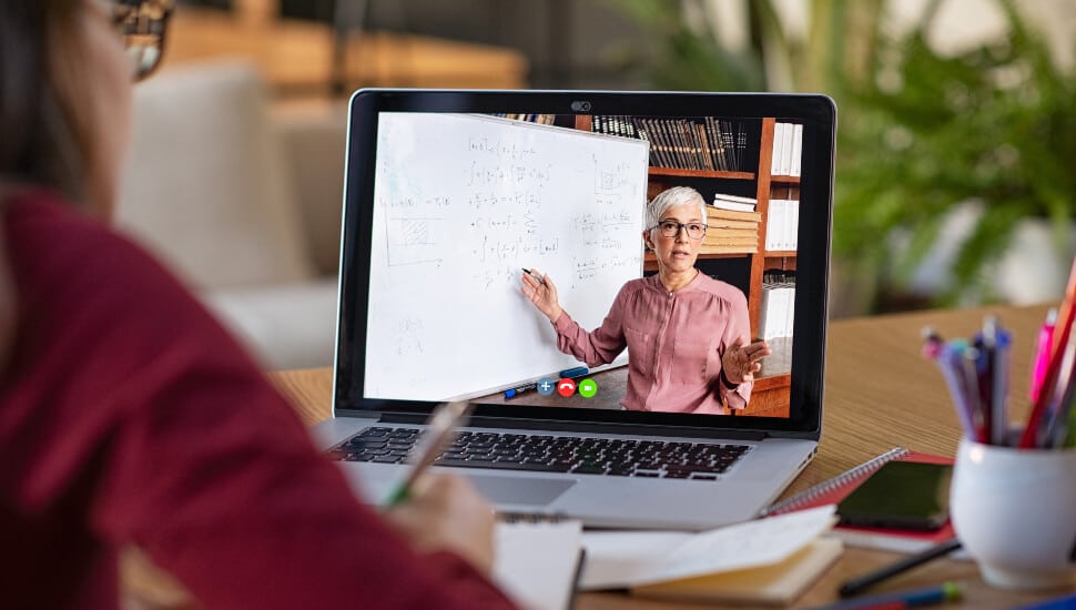 A professor delivering her class via zoom