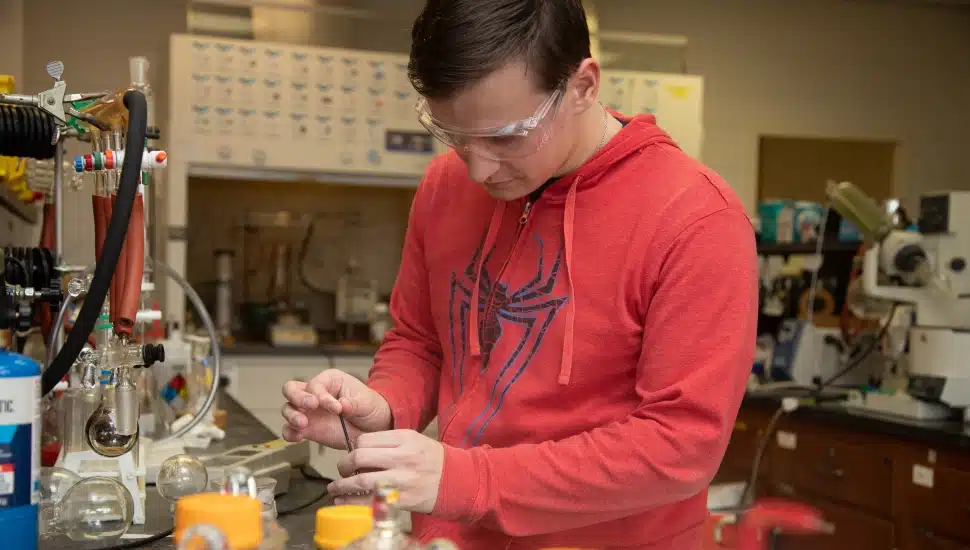 college student in science lab
