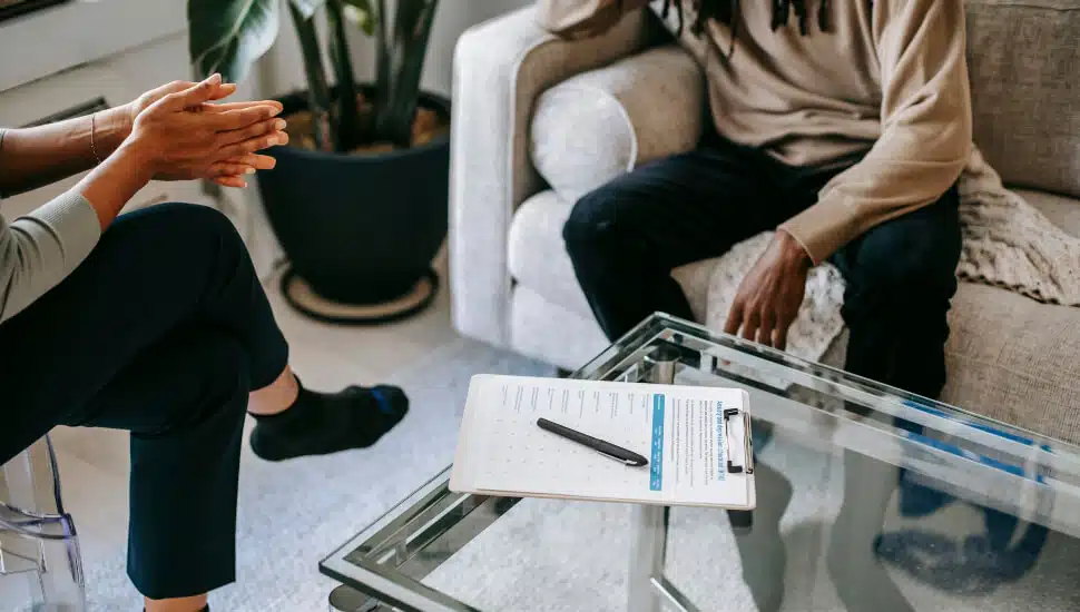 Woman offering man career advice