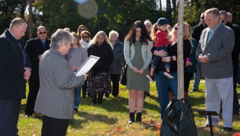 A tree dedication ceremony at Neumann University in memory of Carol Graham.