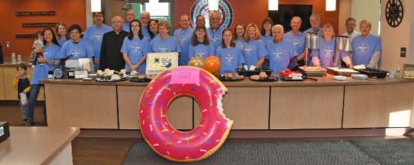 Volunteer staff from the Fellowship Café at Sacred Heart Parish in Royersford are seen with pastor Father Tadeusz Gorka. Image via Christine Klag.