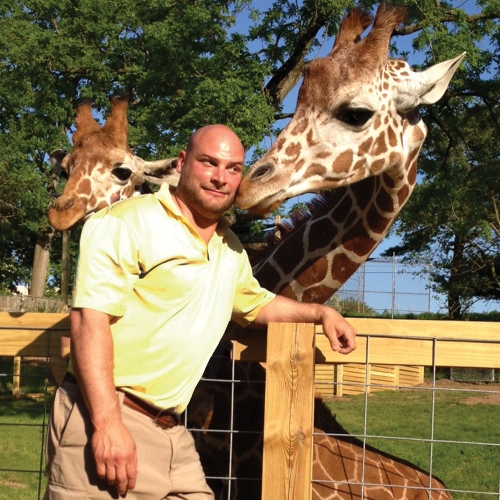 CEO AL Zone with his giraffe friends at the Elmwood Park Zoo.