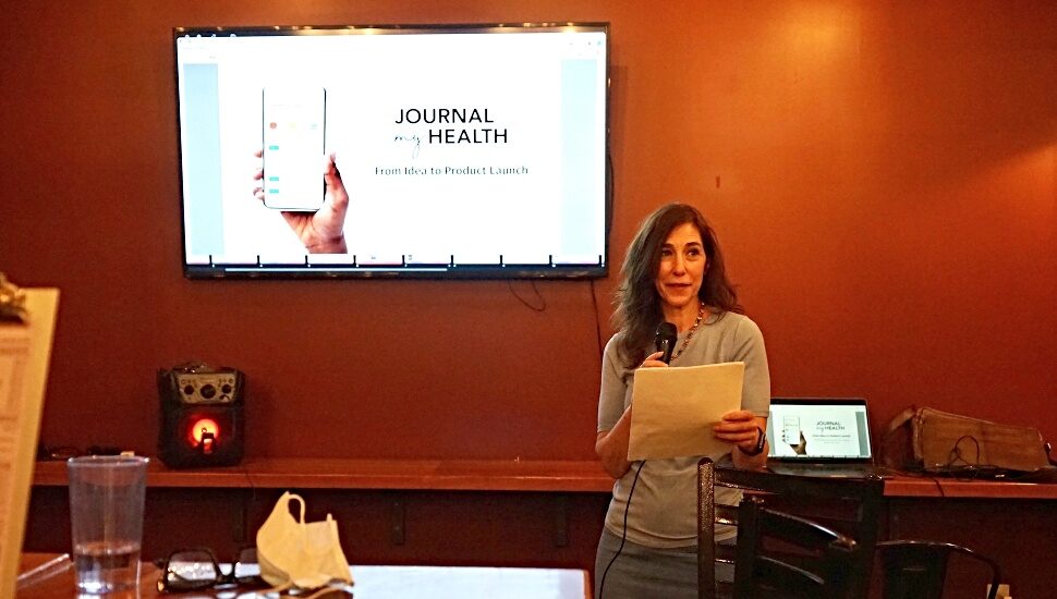 woman at microphone journal my health 2022