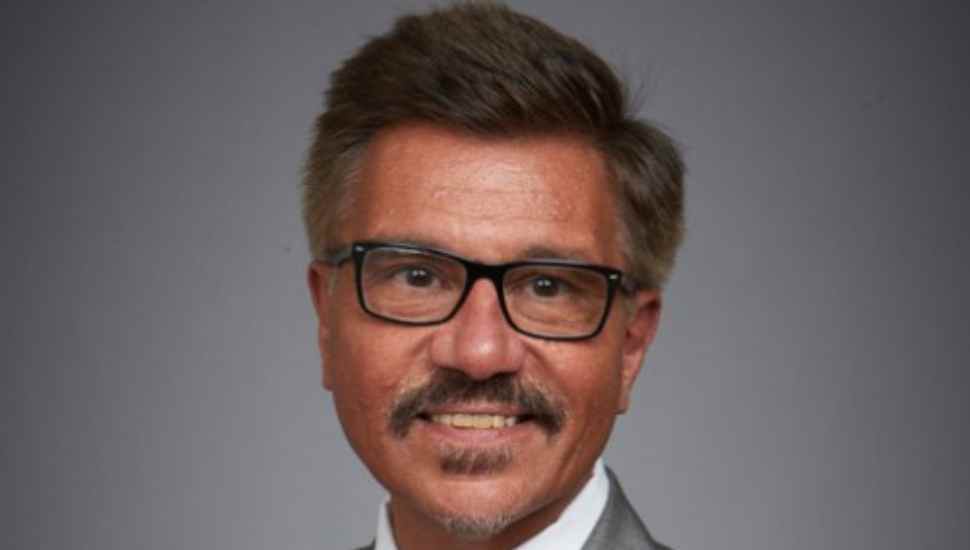 man in suit with glasses