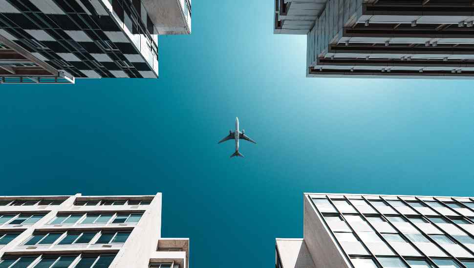plane over buildings