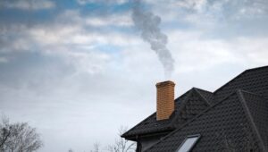 smoke from a brick chimney