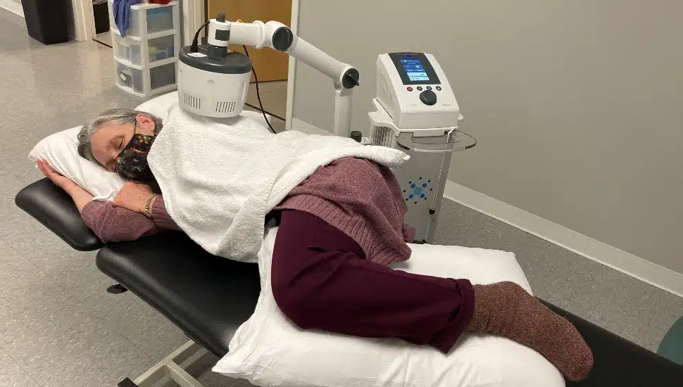 person on physical therapy table