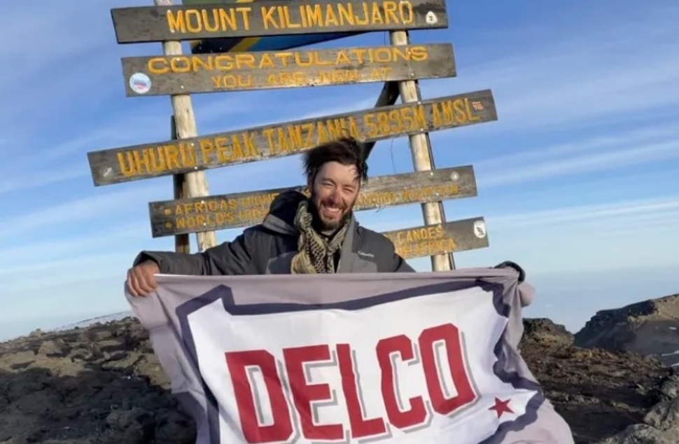 Roddie Cooper at the top of Mount Kilimanjaro.