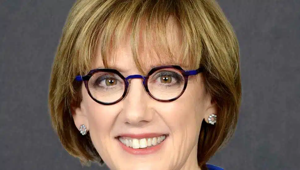 woman with blue glasses