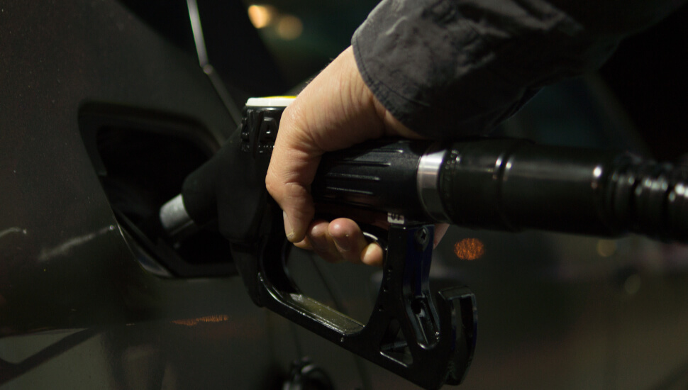A man pumping Gas