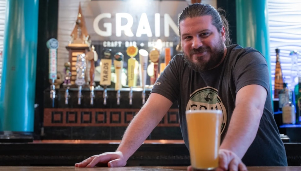 man holding beer
