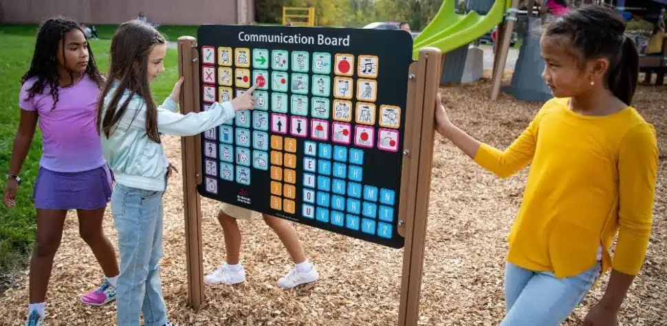 3 girls trying out the Symbol Communication Sign.