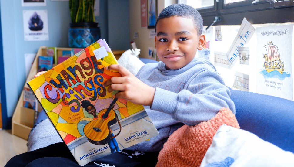 little boy with magazine